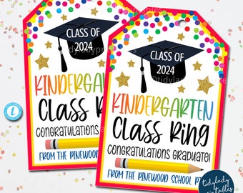 May include: Two colorful graduation gift tags with a rainbow design. The tags feature a black graduation cap with a gold star and the text "Class of 2024" and "Kindergarten Class Ring Congratulations Graduate!"  From the Pinewood School.