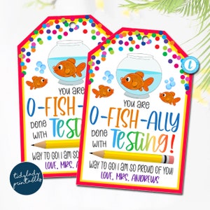 May include: Two colourful printable gift tags with a goldfish in a bowl and the text "You are O-FISH-ALLY done Testing!" and "You are O-FISH- done Testing!" with a pencil underneath. The tags have a confetti background.
