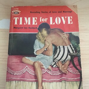 May include: A vintage paperback book cover with a red background and the title "TIME for LOVE" in large white letters. The cover features a couple embracing on a bed with a pink bedspread. The book is a Signet book and was published in 1950.