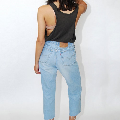 Crop Faded Levis Jeans (27) vintage 80s light blue wash women 6 straight shops leg loose fit cutoff cut off ankle raw hem slouchy high waisted 90s