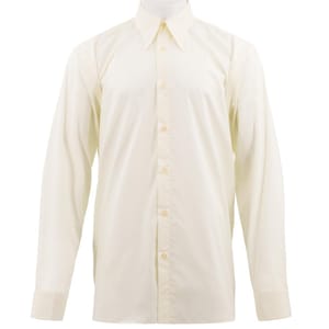 May include: A cream-coloured, long-sleeved shirt with a classic collar and buttoned cuffs. The shirt has a tailored fit and is fastened with buttons down the front. The fabric looks smooth and lightweight, suitable for various occasions.