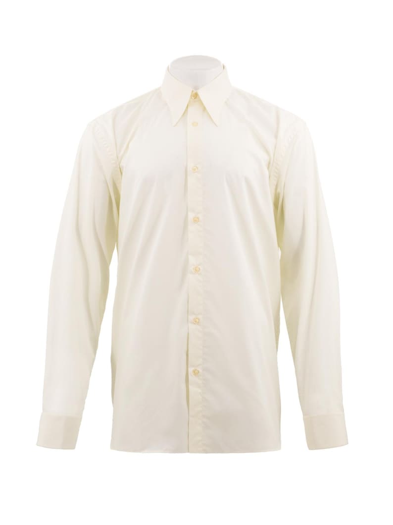 May include: A cream-coloured, long-sleeved shirt with a classic collar and buttoned cuffs. The shirt has a tailored fit and is fastened with buttons down the front. The fabric looks smooth and lightweight, suitable for various occasions.