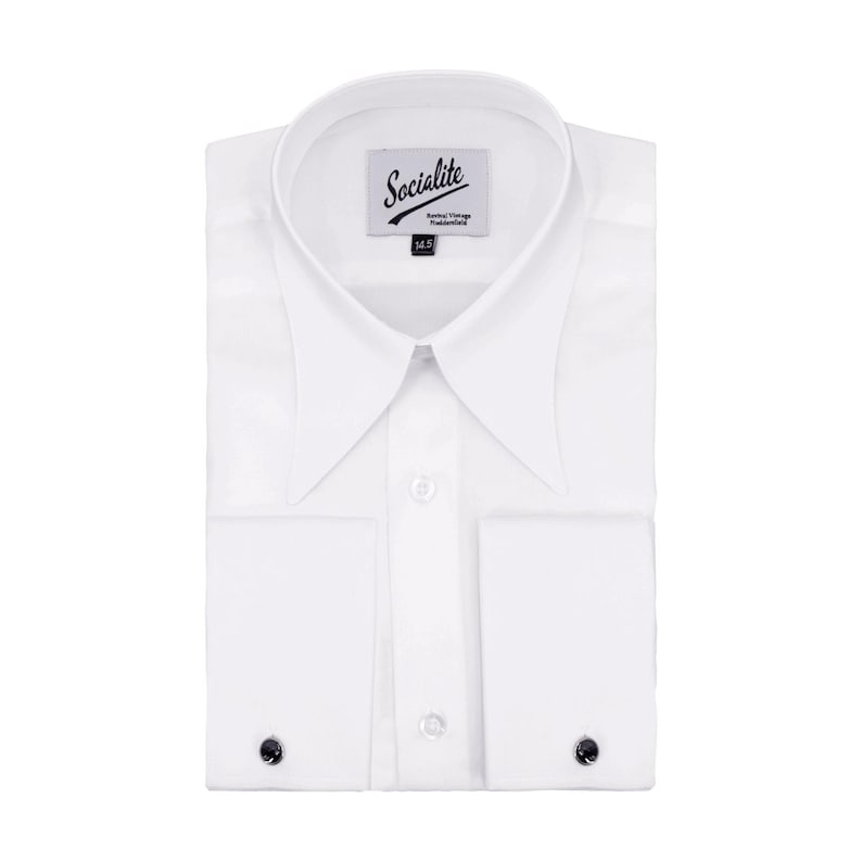 May include: A folded white dress shirt with a spread collar and French cuffs. The shirt has a label that reads "Socialite". The cuffs feature black cuff links. The shirt is a classic formal wear item.