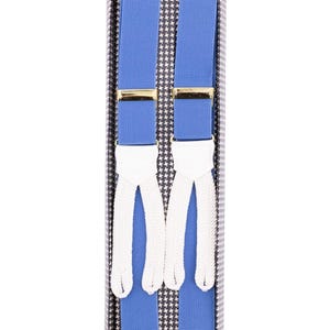 May include: Blue suspenders with white ends and gold-coloured clasps, presented in a box with a black and white houndstooth pattern. The suspenders are a vibrant blue colour, and the white ends are a contrasting element.