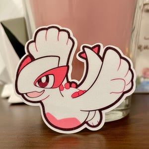 Glanzende Lugia-glittervinylsticker