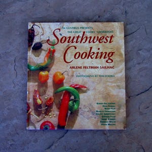 May include: A cookbook titled "Southwest Cooking" with a cover featuring various chili peppers. The cover text includes the author's name, Arlene Feltman-Sailhac, and the photographer, Tom Eckerle. The book is part of "The Great Cooks' Cookbooks" series.