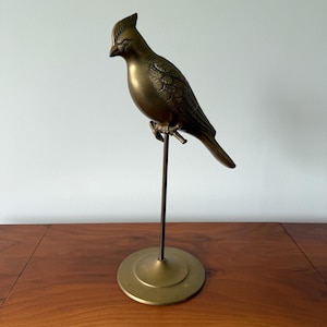vintage brass cockatiel/parrot sitting on a. stand