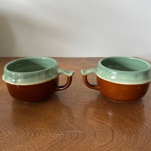 Pair of red wing oomph aqua and brown flat cups or mugs