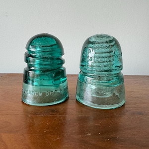 vintage blue green glass insulators set of 2