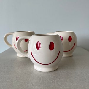 Vintage 1970s white McCoy smiley face mug