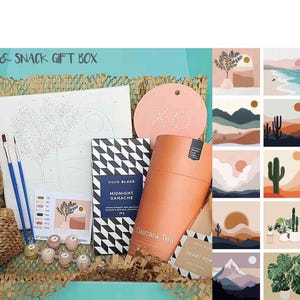 Puede incluir: Una caja de regalo de pintura, bebida y aperitivos con un lienzo de pintura por n&uacute;meros, una barra de cacao y ganache, una bolsita de t&eacute; y un posavasos en forma de coraz&oacute;n. La caja tambi&eacute;n incluye pinceles, botes de pintura y una variedad de aperitivos. La caja est&aacute; decorada con un material tejido marr&oacute;n y beige.