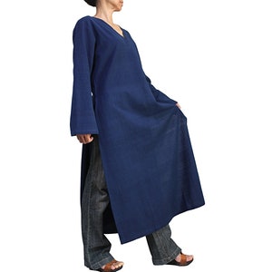 May include: A long, navy blue tunic with a V-neck and long sleeves. The tunic is made of a soft, comfortable fabric and has a relaxed fit.