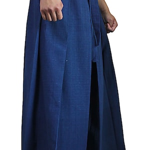 May include: A pair of wide-legged pants with a deep blue color and a tie at the waist.