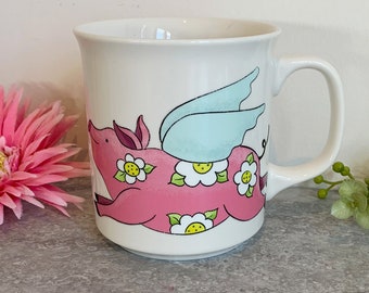 Porcelain cup flying pink pig illustration flying pig