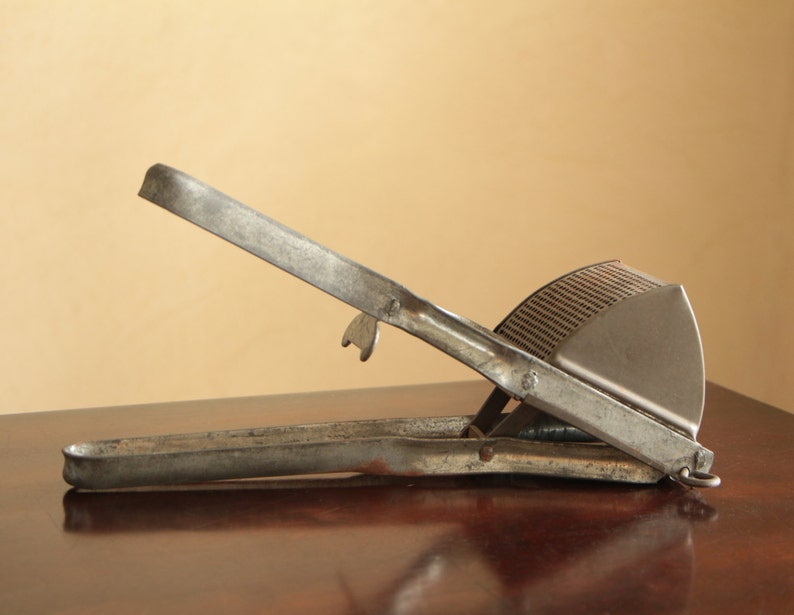 Vintage potato masher or potato ricer / industrial metal Etsy