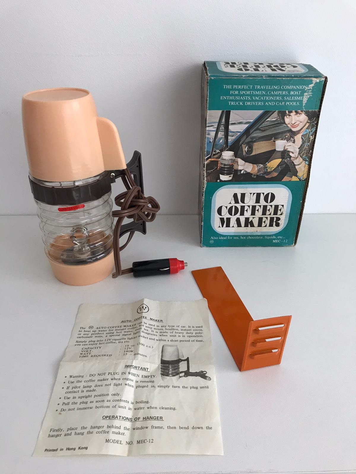 old 1970s 12 volt electric travel coffee maker made for a car picnic and  motoring Stock Photo - Alamy