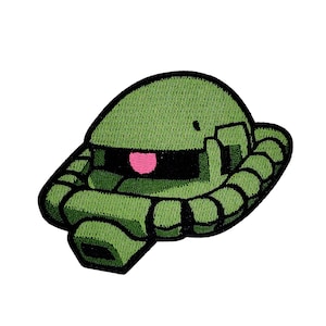 May include: Green embroidered patch of a cartoon robot head with a pink visor.
