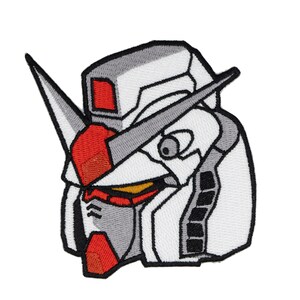 May include: Embroidered patch of a white and gray robot head with red accents. The robot has a large, pointed head with a single eye and a small mouth.