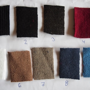 May include: Nine fabric swatches in different colors and textures, numbered 1 through 9. The swatches are arranged in two rows of five, with the last swatch in the second row missing.