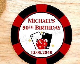 May include: A round casino-themed birthday coaster with a red, black, and white design. The coaster features the text "MICHAEL'S 50TH BIRTHDAY" and the date "12.05.2040". It also includes playing card suits and a red die.
