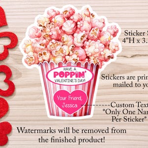 May include: A pink and white Valentine's Day sticker featuring a popcorn bucket with the text "Have a Poppin' Valentine's Day". The sticker is 4 inches high and 3.5 inches wide. The sticker also includes a space for a personalized message.
