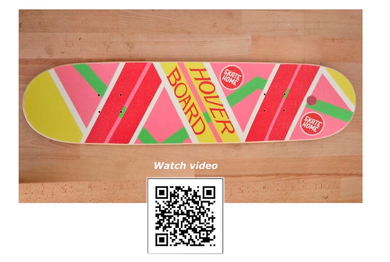 May include: A pink, yellow, and green skateboard with the words "Hover Board" printed on it. The skateboard has two red circles with the words "Skate Home" printed on them.