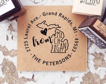 May include: A custom self-inking stamp with the text "from" and a heart over a Michigan outline. The stamp includes the address "2725 Laurel Ave., Grand Rapids, MI 49503" and "The Petersons" in a circular design.