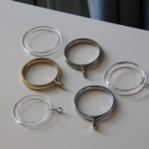 a group of metal rings sitting on top of a white table