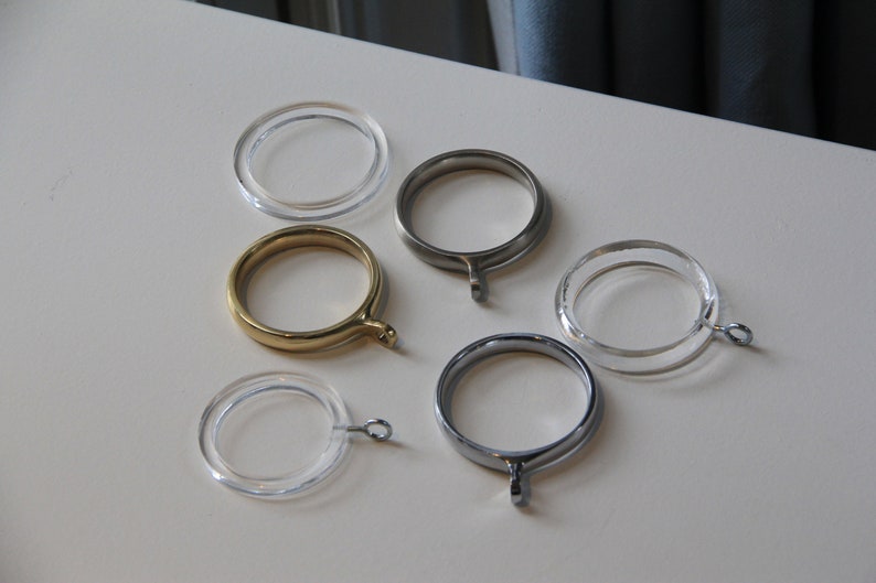 a group of metal rings sitting on top of a white table