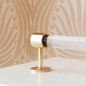 a toilet roll holder on a white counter