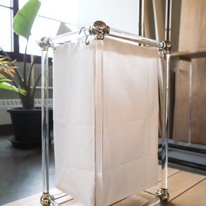 a white bag sitting on top of a wooden table