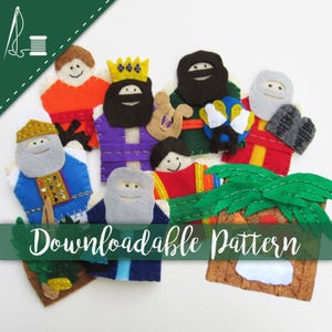 May include: A set of felt finger puppets depicting characters from the Bible story of the Nativity. The puppets include a king, a shepherd, a wise man, and a baby Jesus. The puppets are all brightly colored and have friendly faces. The set also includes a felt palm tree and a felt manger.