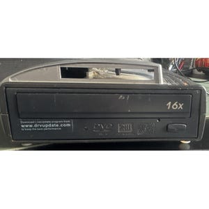 May include: A black external DVD drive with a 16x speed label on the front tray. The front panel features a small eject button, a status light, and logos for DVD RW and CD-RW. Text on the left reads: Download LiveUpdate program from www.drvupdate.com to keep the best performance.