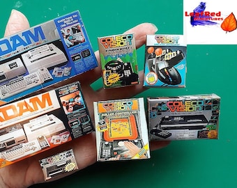 Miniature set COLECOVISION. 7 boxes, expansion, controllers, Adam