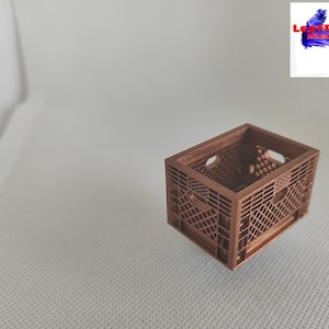 May include: A miniature brown plastic crate, similar to a milk crate, with a grid pattern. The crate is empty and appears to be made of a sturdy material.