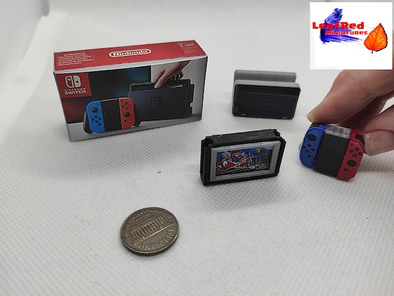 NINTENDO SWITCH. Miniature Console With Box and Controllers