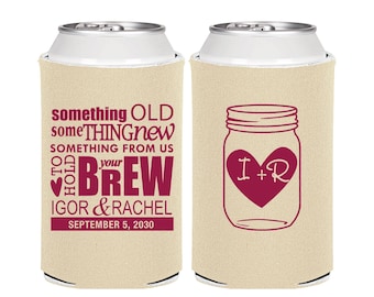 May include: Two beige foam can coolers featuring maroon text and graphics. The left cooler displays the text something OLD something NEW SOMETHING FROM US TO HOLD your BREW IGOR & RACHEL SEPTEMBER 5, 2030. The right cooler shows a mason jar with a heart.