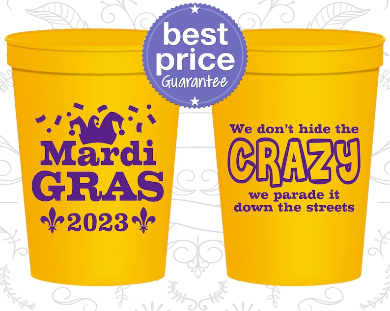 May include: Two yellow plastic cups with purple text. The cup on the left says 'Mardi Gras 2023' with a purple jester's hat and confetti. The cup on the right says 'We don't hide the CRAZY we parade it down the streets'. A purple circle with a white star and the text 'best price Guarantee' is in the top left corner of the image.