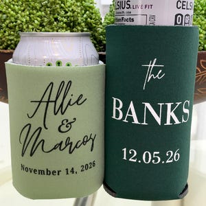 Two green and white beverage coolers with personalized text printed on them.