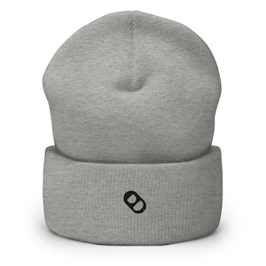 May include: Gray beanie with a black double circle logo.