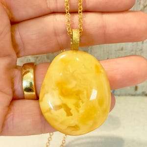 Butterscotch genuine amber pendant.White amber pendant.Natural shape amber jewelry.Light yellow amber pendant.Pendant with golden silver.