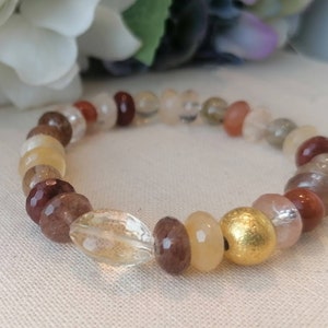 Rutilated Quartz bracelet. Gemstone beads bracelet with golden silver. Elastic bracelet with gold rutilated quartz. Healing stone bracelet.
