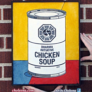 May include: A white can of chicken soup with a black Dharma Initiative logo and the text "Dharma Initiative Chicken Soup" on a yellow, blue, and red background.