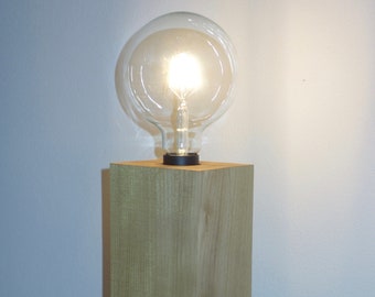 Table lamp made of piece of wood