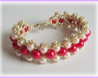 May include: A gold and silver beaded bracelet with alternating red and white pearls.