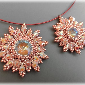 May include: Two copper-toned beaded snowflake pendants with iridescent crystals hanging from a red cord.