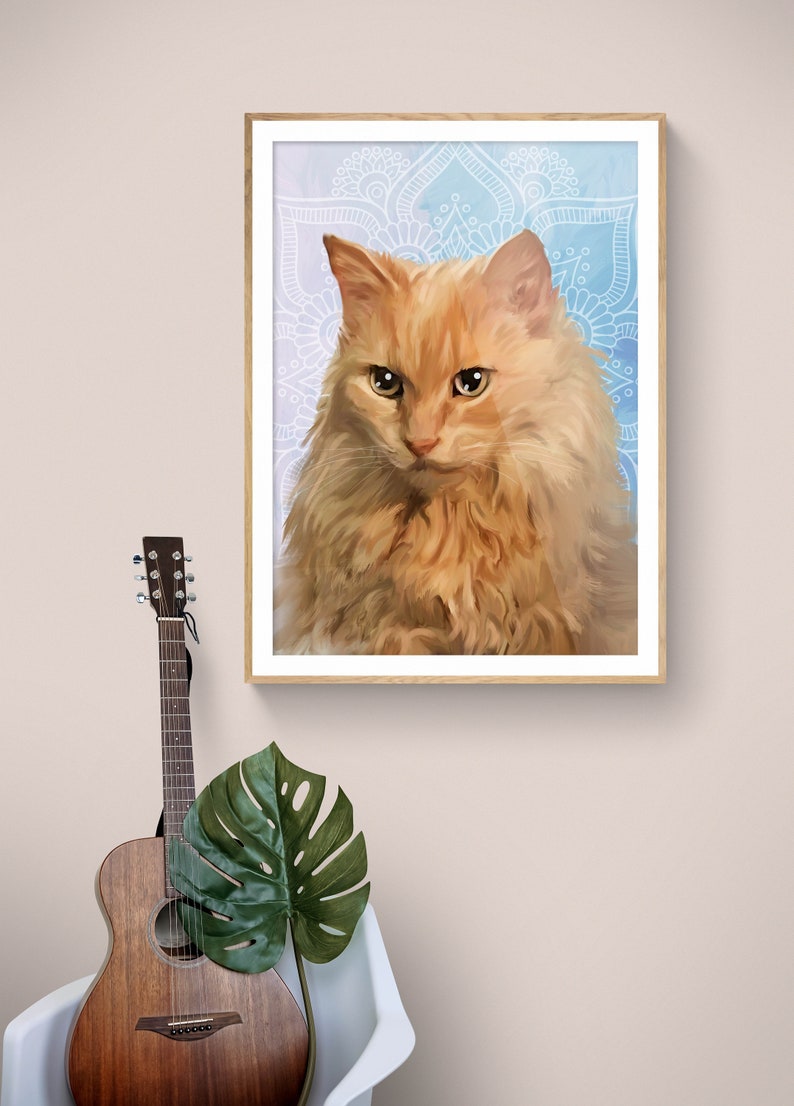 May include: A framed print of a ginger cat with a white mandala pattern background. The cat is looking directly at the viewer with a serious expression.
