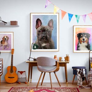 May include: Three framed watercolor paintings of dogs. The paintings are hung on a white wall in a room with a wooden desk, a chair, a guitar, and a bed. The paintings feature a French Bulldog, a Beagle, and an Australian Shepherd.