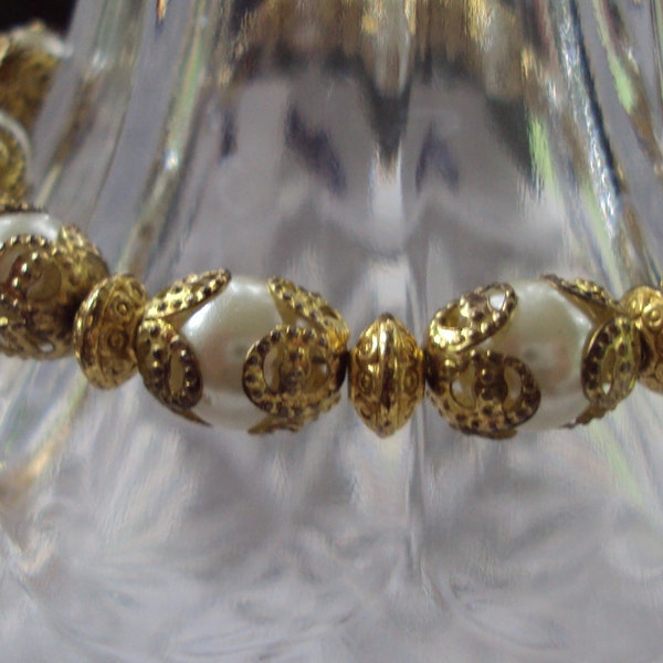 Pearl Bracelet with Mother Charm and Gold Beadcaps