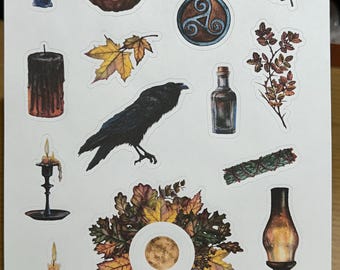 May include: A sticker sheet featuring various autumn and mystical illustrations including a black raven, a pumpkin with a triquetra symbol, candles in holders, a crescent moon, a glass bottle, a sage bundle, and a wreath of colorful fall leaves.